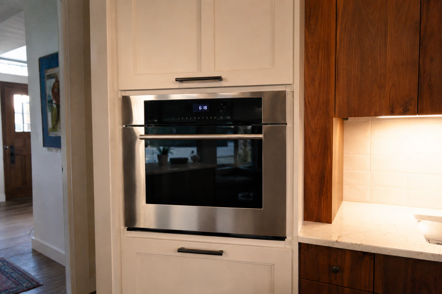 a Wolf wall oven built into cabinetry